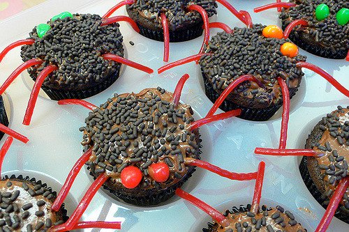 Demon evil looking spider cupcakes for Halloween spider cupcakes with red legs and red evil eyes