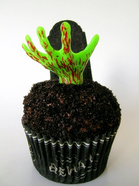 Zombie hand rising from chocolate earth graveyard cupcakes for Halloween how to make zombie hand cupcakes decorate design