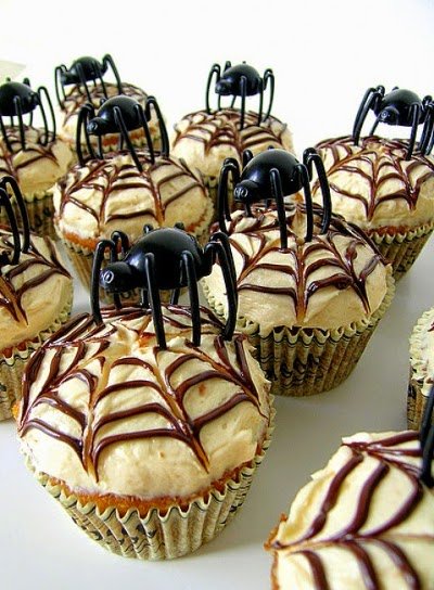 Spider themed cupcakes for Halloween Cupcakes with cobweb icing and spider toppers