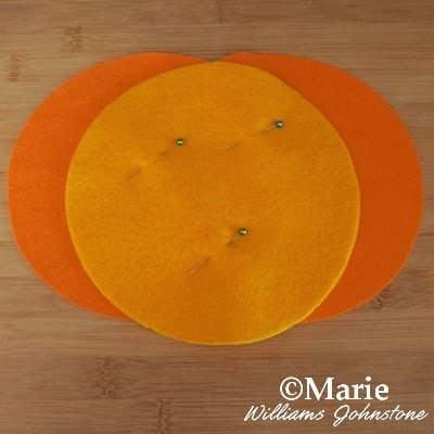 Pinned orange felt fabric 
