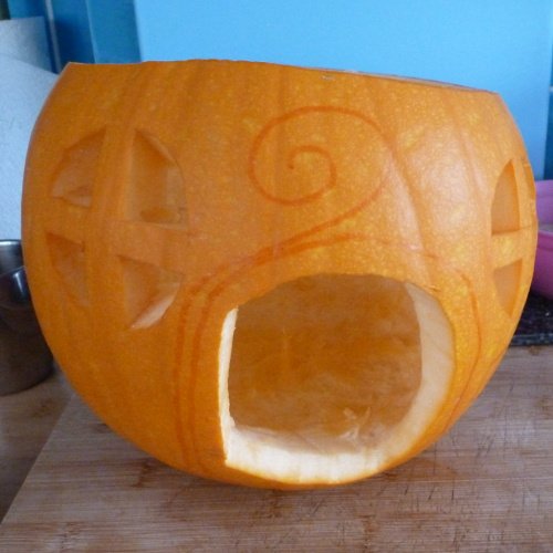 Drawing detail on the pumpkin for carving 