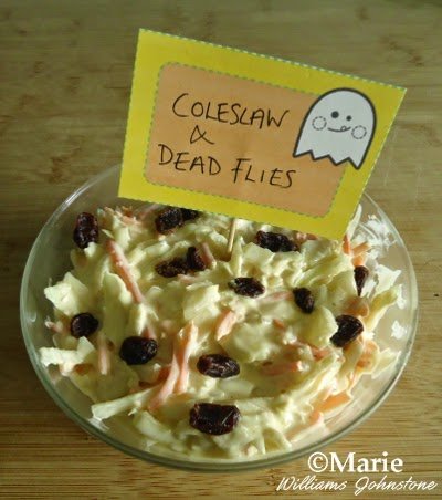 Coleslaw with raisins added to look like dead flies