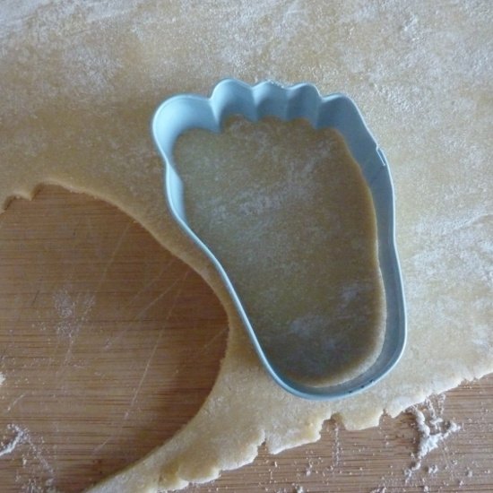 feet foot cookie cutter cutting out rolled out dough