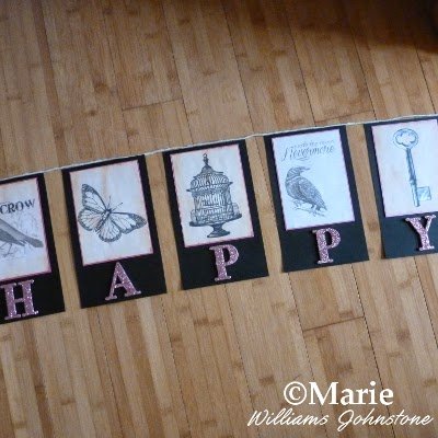 DIY handmade paper flag sections with bird, birdcage, key, and butterfly images