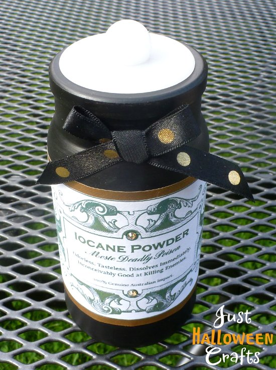 black painted jar with iocane label and satin bow detail