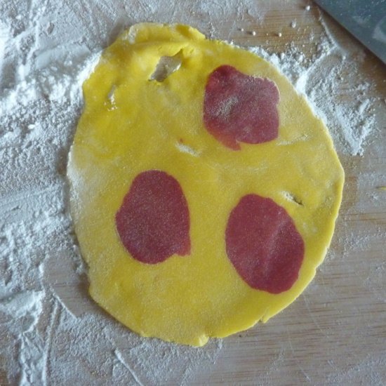 adding different colors into the rolled fondant icing yellow and red red and yellow rolled fondant icing