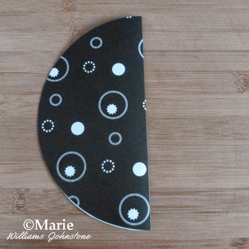 Folded circle of black and white paper