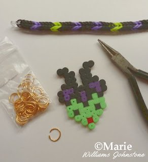 Adding a perler hama bead charm to a rubber band bracelet design