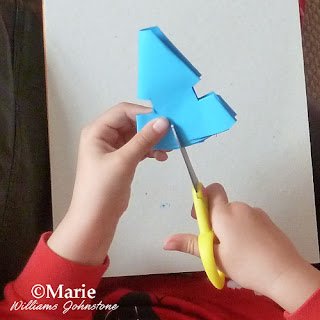 cutting the folded paper