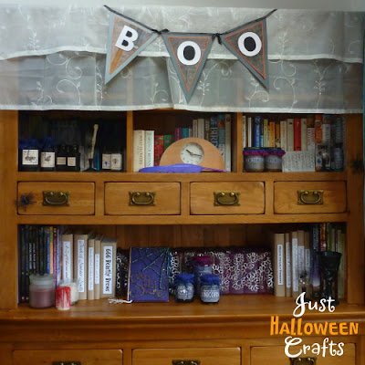 Apothecary cabinet with Halloween banner and props 
