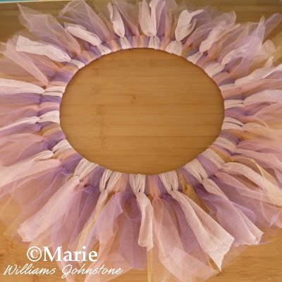 Tulle strips of netting tied around a wreath base