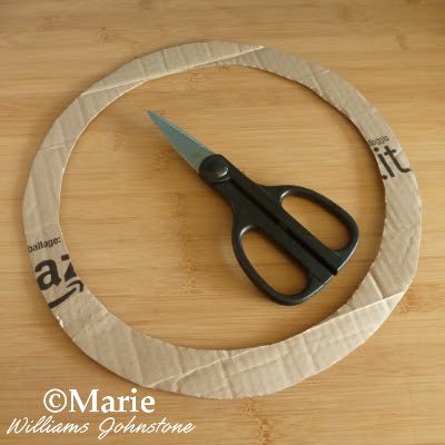Scissors used to cut out wreath shape from card