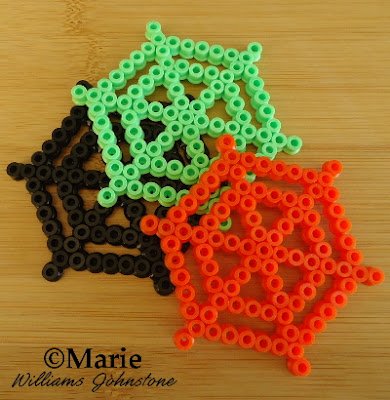 webs spider cobwebs bead design black green orange