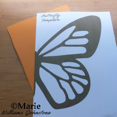 Paper with wing printed on to it and orange card