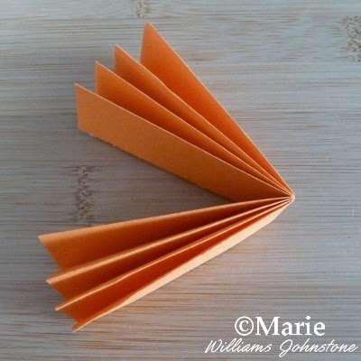 Folded orange piece of paper