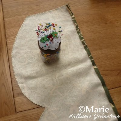 Pinning the raw edges of fabric ready to sew