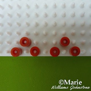 Brown beads on the peg board