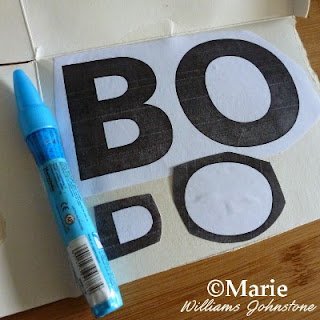 Printed BOO letters stuck onto cardboard backing with a Zig glue pen