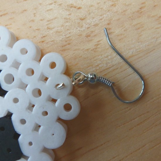 Earring hook inserting into a completed Perler bead motif