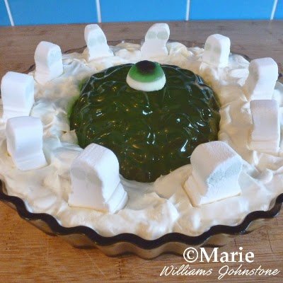 Halloween themed zombie trifle with ghosts and eyeball decorations