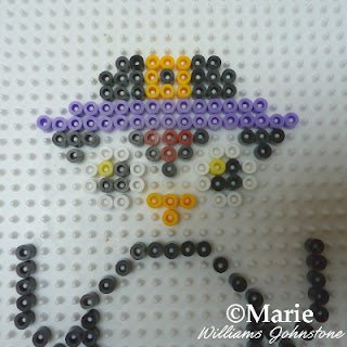 Adding in purple beads