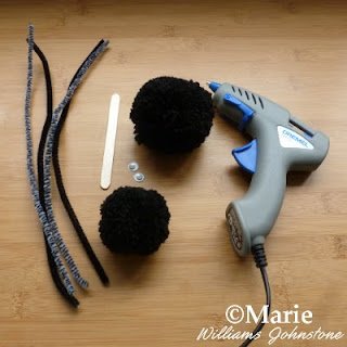 Chenille stems pipe cleaners popsicle craft stick googly eyes black yarn pom poms and glue gun