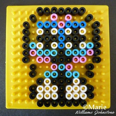Adding lots of colors to a pegboard to make up a picture