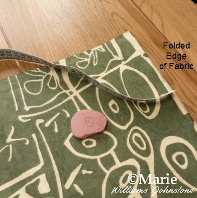 Fabric, pink tailor's chalk, measure tape