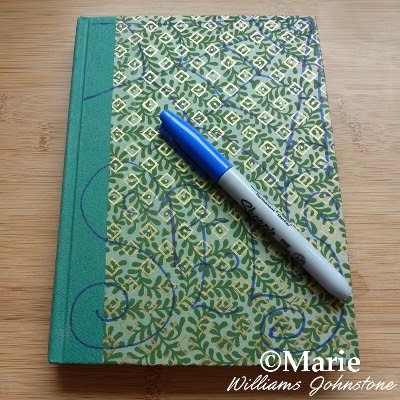 Sharpie pen and hard cover notebook