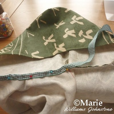 Using a length of ribbon to hide inside seams