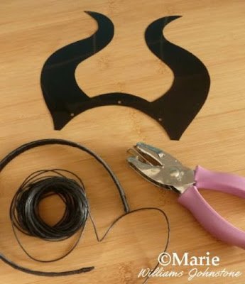 Hole punch, black horns design, hair band and cord