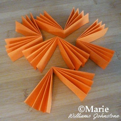 5 pieces of concertina folded paper to make a round fan
