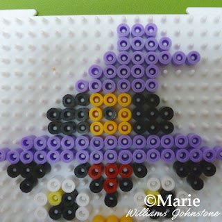 Finishing the top section of the pattern on the peg board
