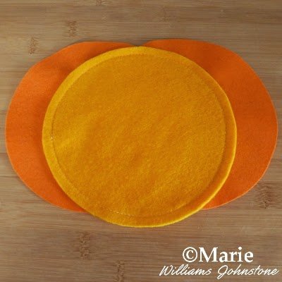 Machine stitched fabric in two tones of orange