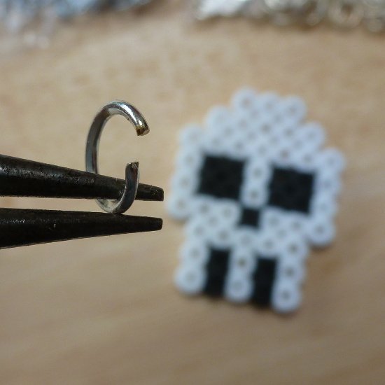 Open open jump ring jewelry equipment held with pliers