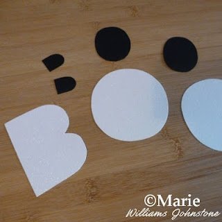 White cardstock BOO letters cut out with black inside pieces