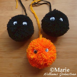 Black and orange yarn colors with wiggle eyes